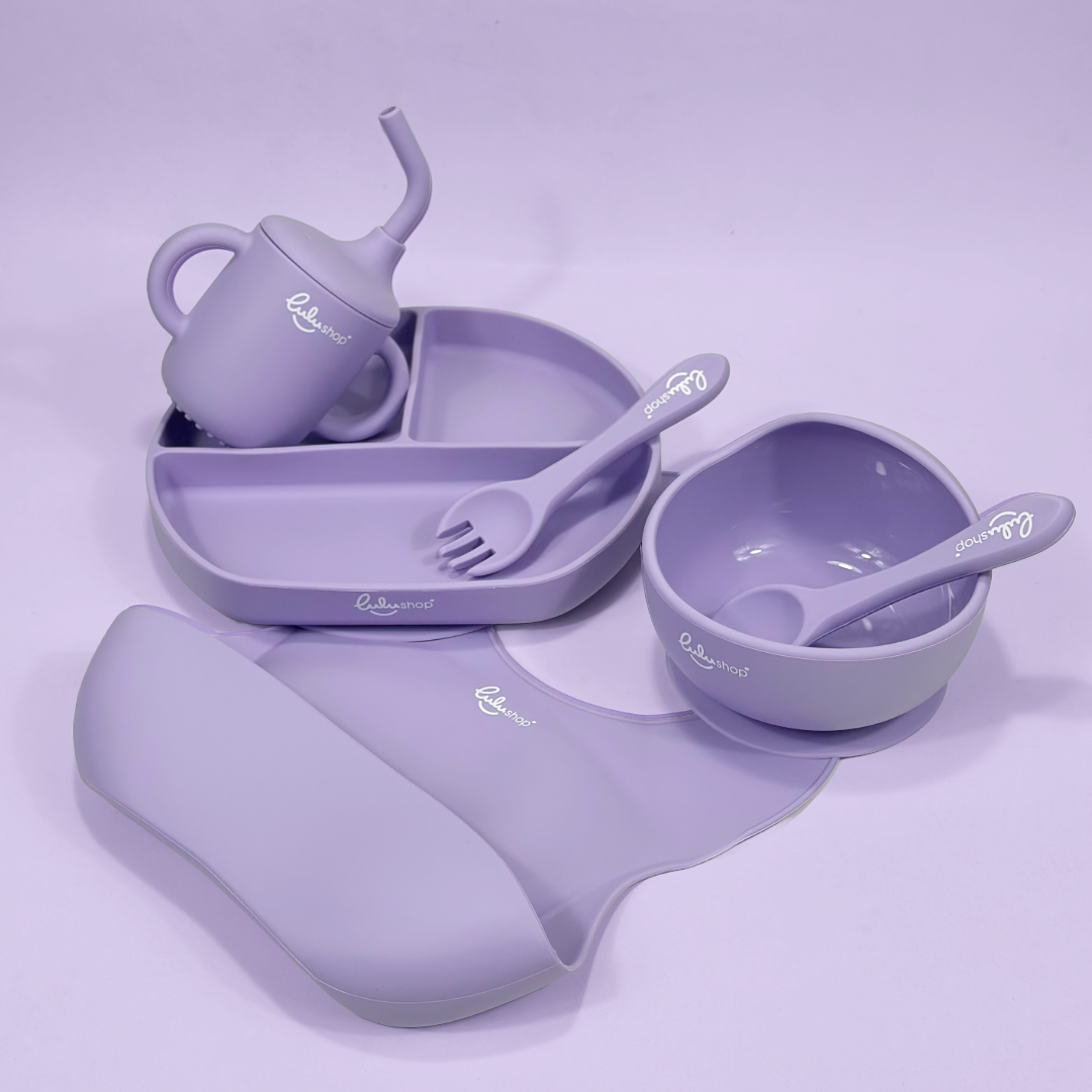 Lulushop 6-piece baby feeding set in Lavander Mist, featuring silicone suction plate, bowl, bib, cup, and utensils.