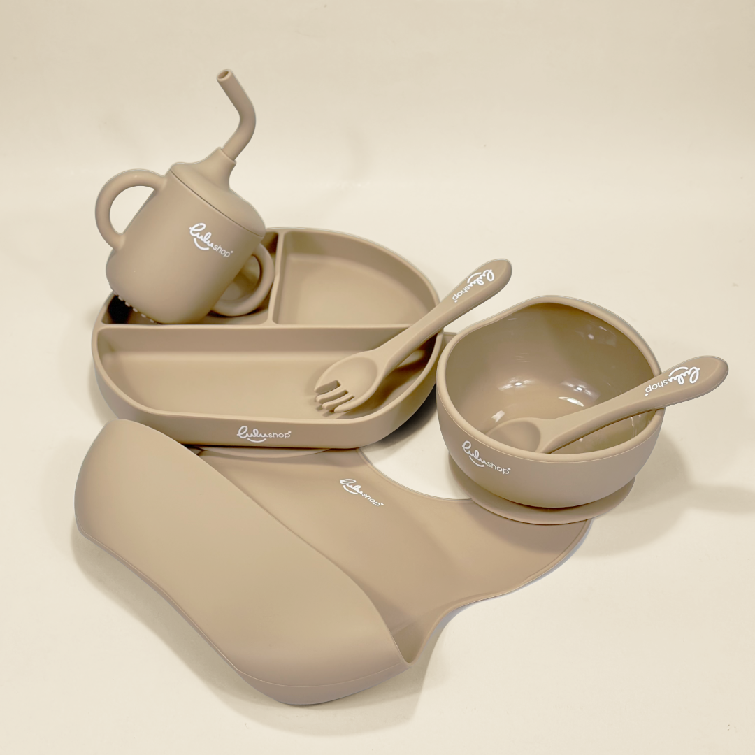 Lulushop 6-piece baby feeding set in Light Apricot, featuring silicone suction plate, bowl, bib, cup, and utensils.