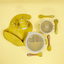 Lulushop 9-piece baby feeding set in Saffron Mango, featuring silicone suction plate, bowl, bib, cup, and utensils.